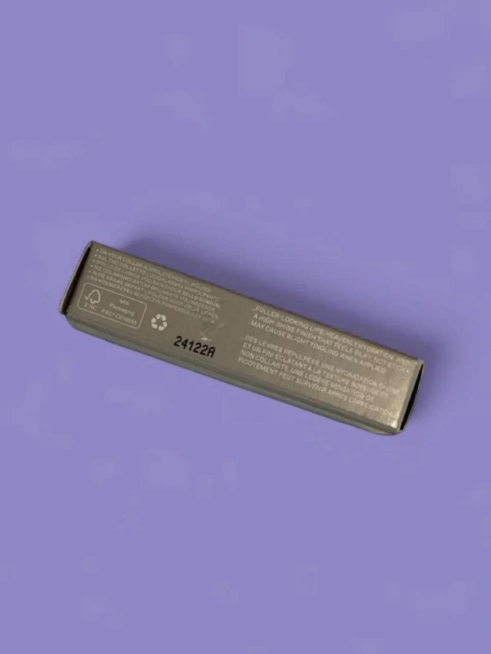 R.E.M. Beauty Plumping Iridescent Purple Lip Gloss in shade Chuckie